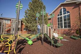 Play ground area at a church, shows professionally installed equipment with soft medium on the ground, referenced in the text.